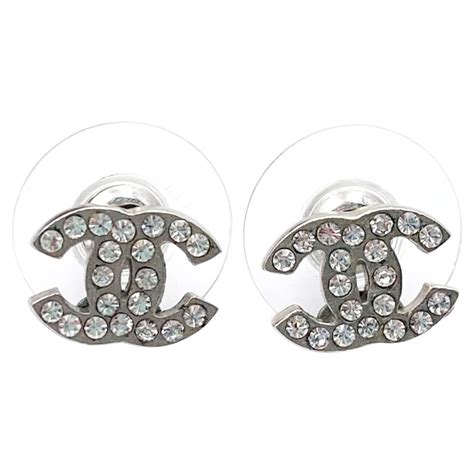 small silver chanel earrings|Chanel boutique earrings.